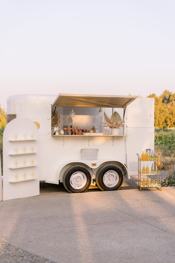 mobile bar at a wedding venue park winters engagement session by adrienne and dani photography