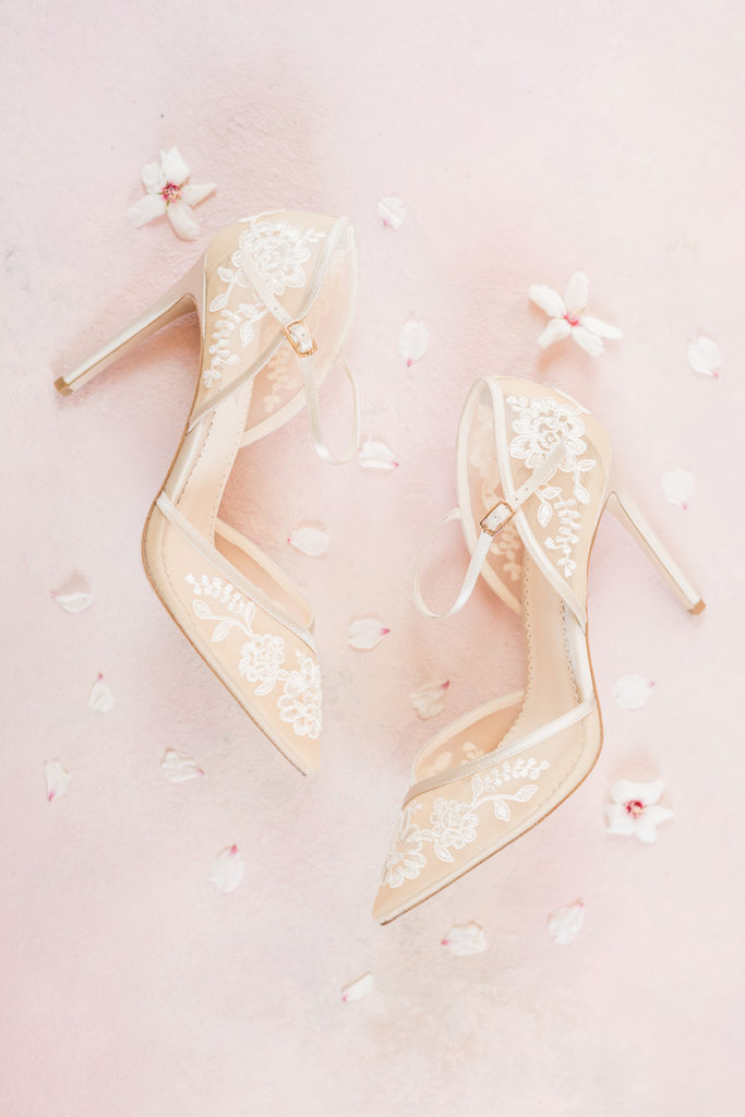 bella belle bridal heels surrounded by almond blossom petals