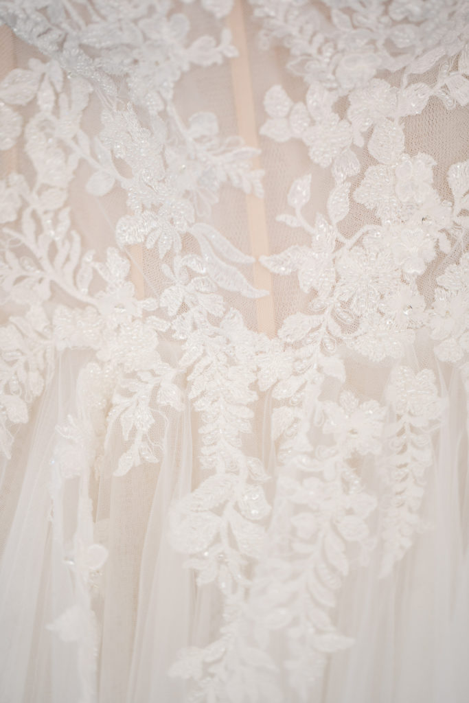 close up detail of bride's wedding dress