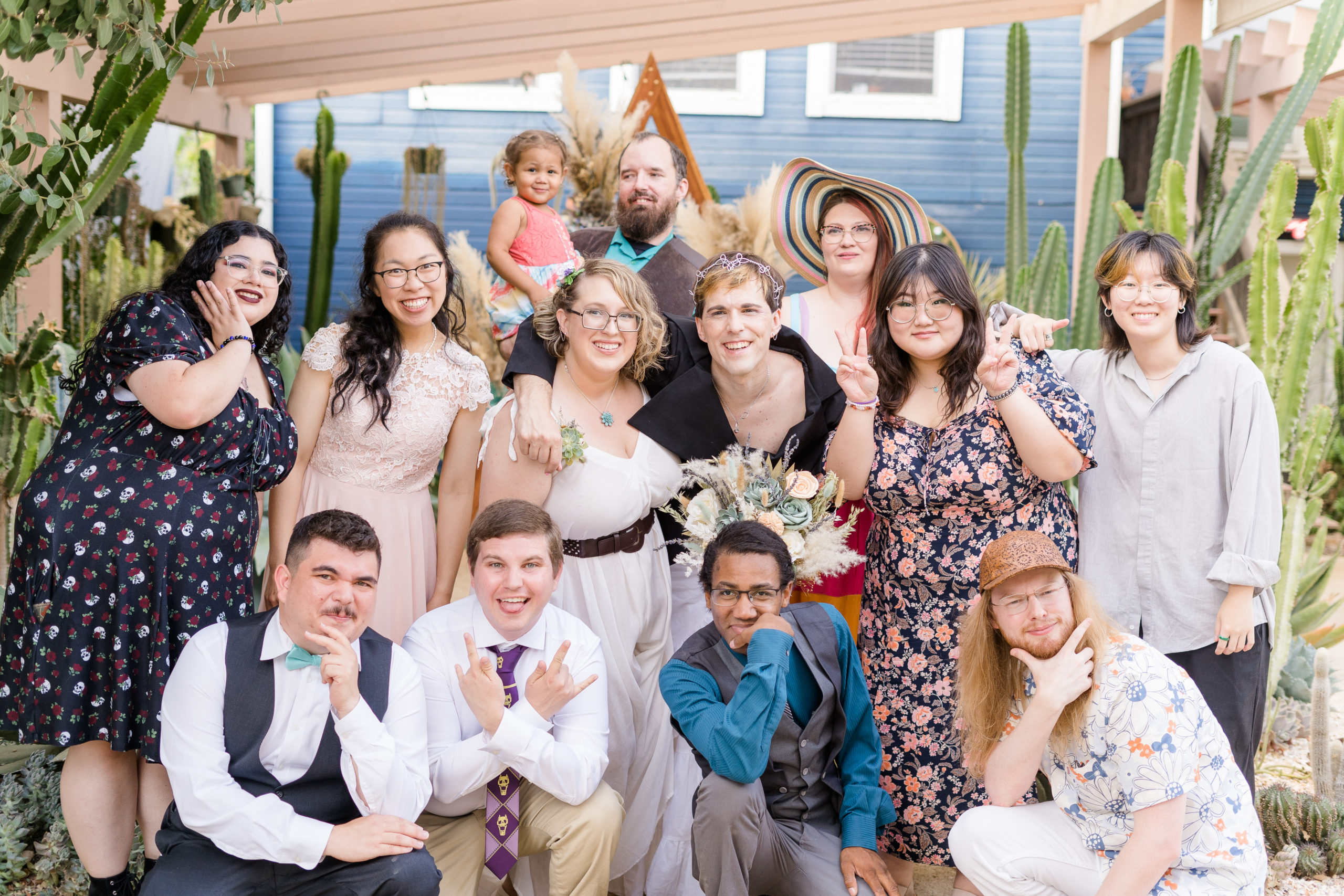 a bride and groom pose with their close friend group for a wedding day family portrait by adrienne and dani photography, Napa Wedding Photographers