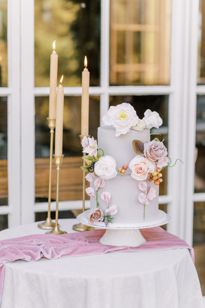 a wedding cake with sugar flowers at villa montalvo in Saratoga, CA