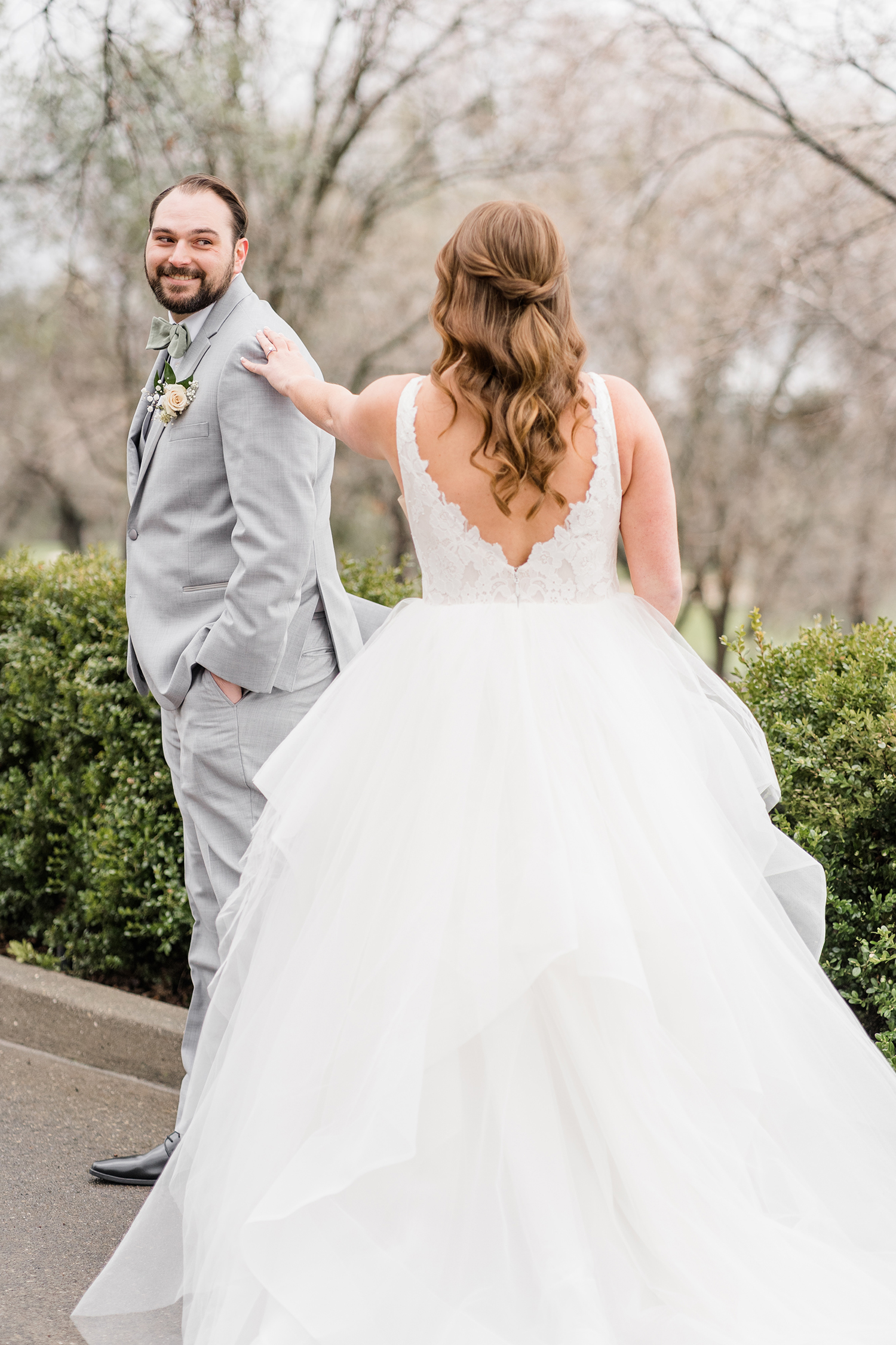 a bride and groom share a first look at their wedding at the Ridge Event Center by Adrienne and Dani Photography