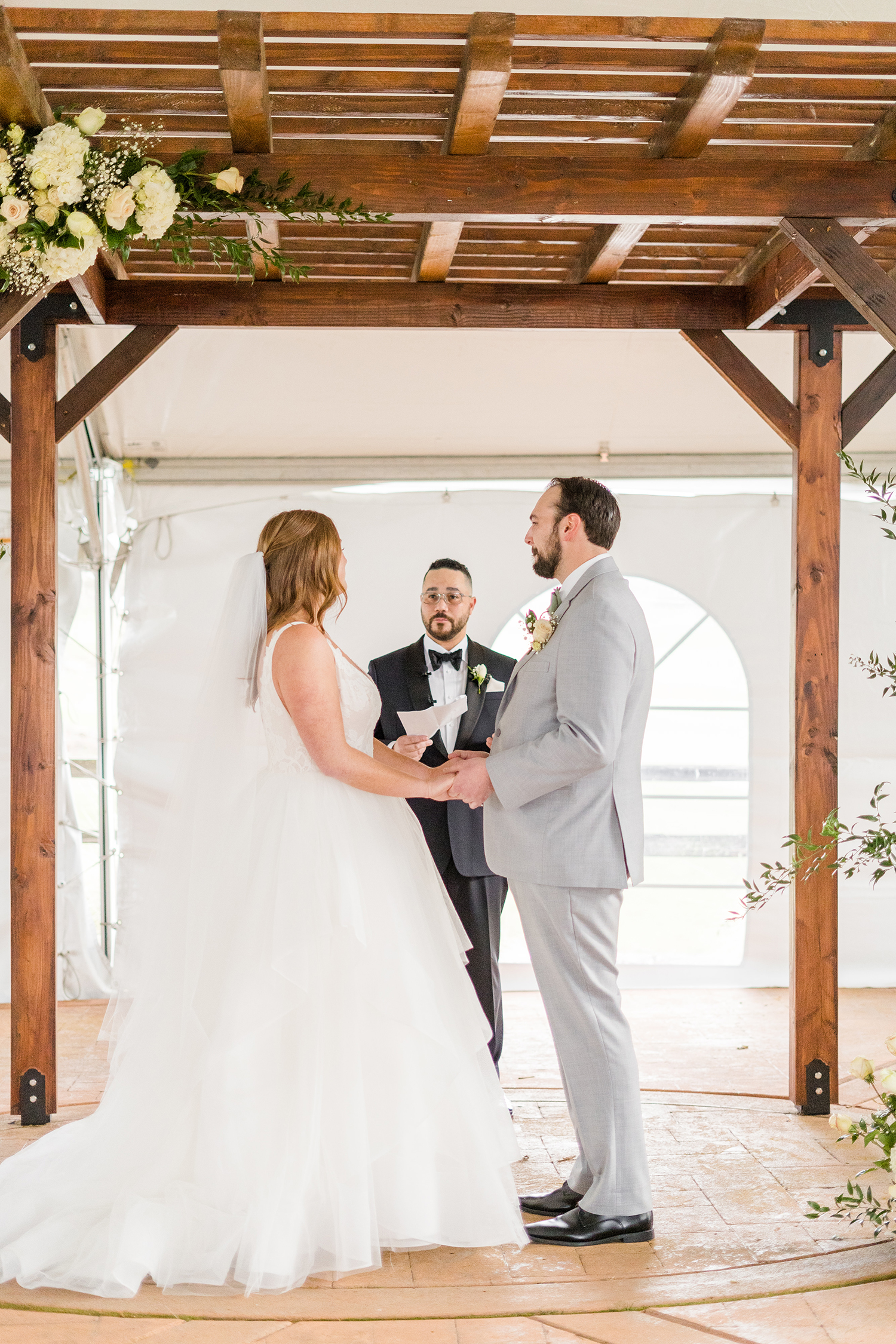 a wedding ceremony at the Ridge Event Center by Adrienne and Dani Photography