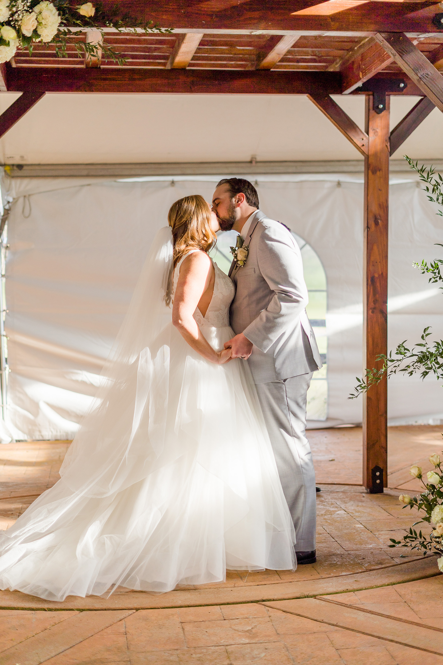 a wedding ceremony at the Ridge Event Center by Adrienne and Dani Photography