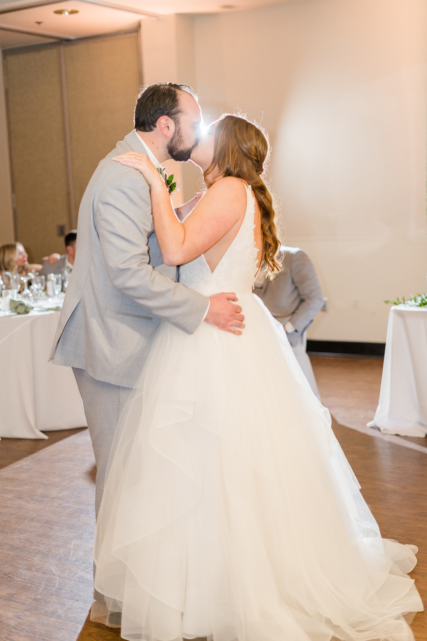 a bride and groom share their first dance at the Ridge Event Center by Adrienne and Dani Photography