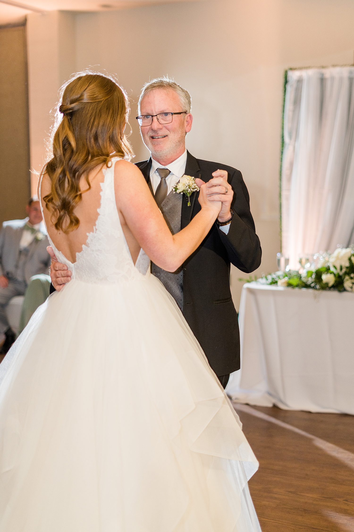 a bride dances with her father at the Ridge Event Center by Adrienne and Dani Photography