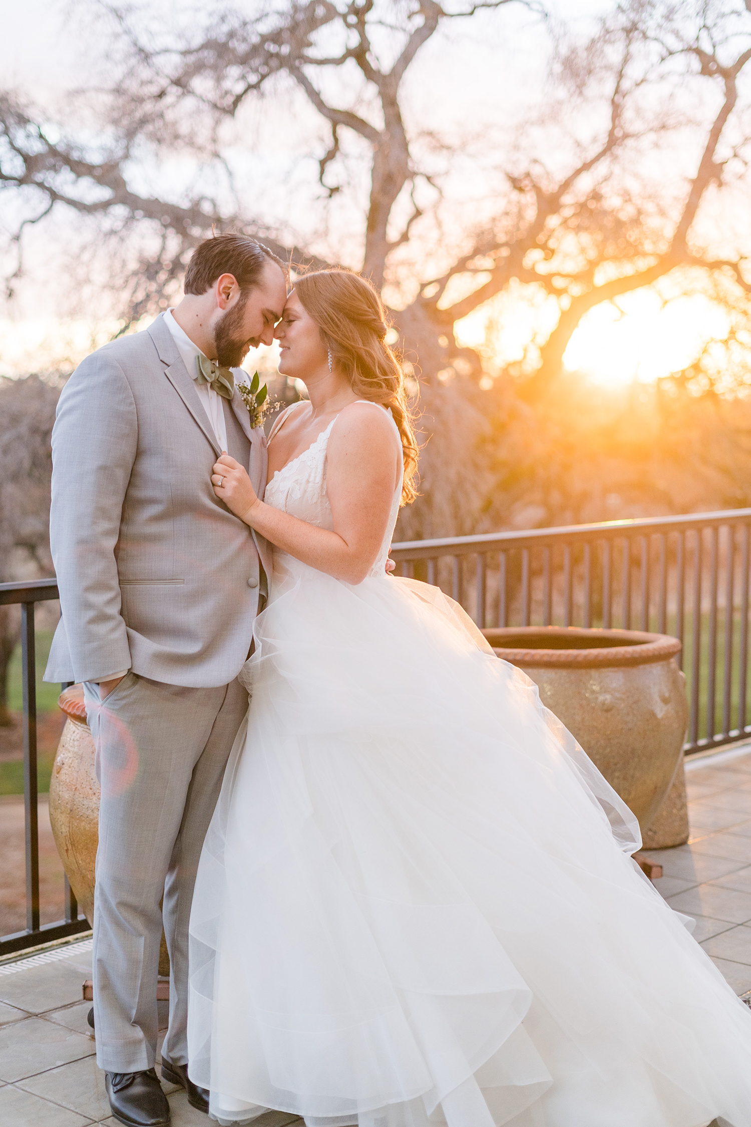 a bride and groom pose for sunset portraits at the Ridge Event Center by Adrienne and Dani Photography