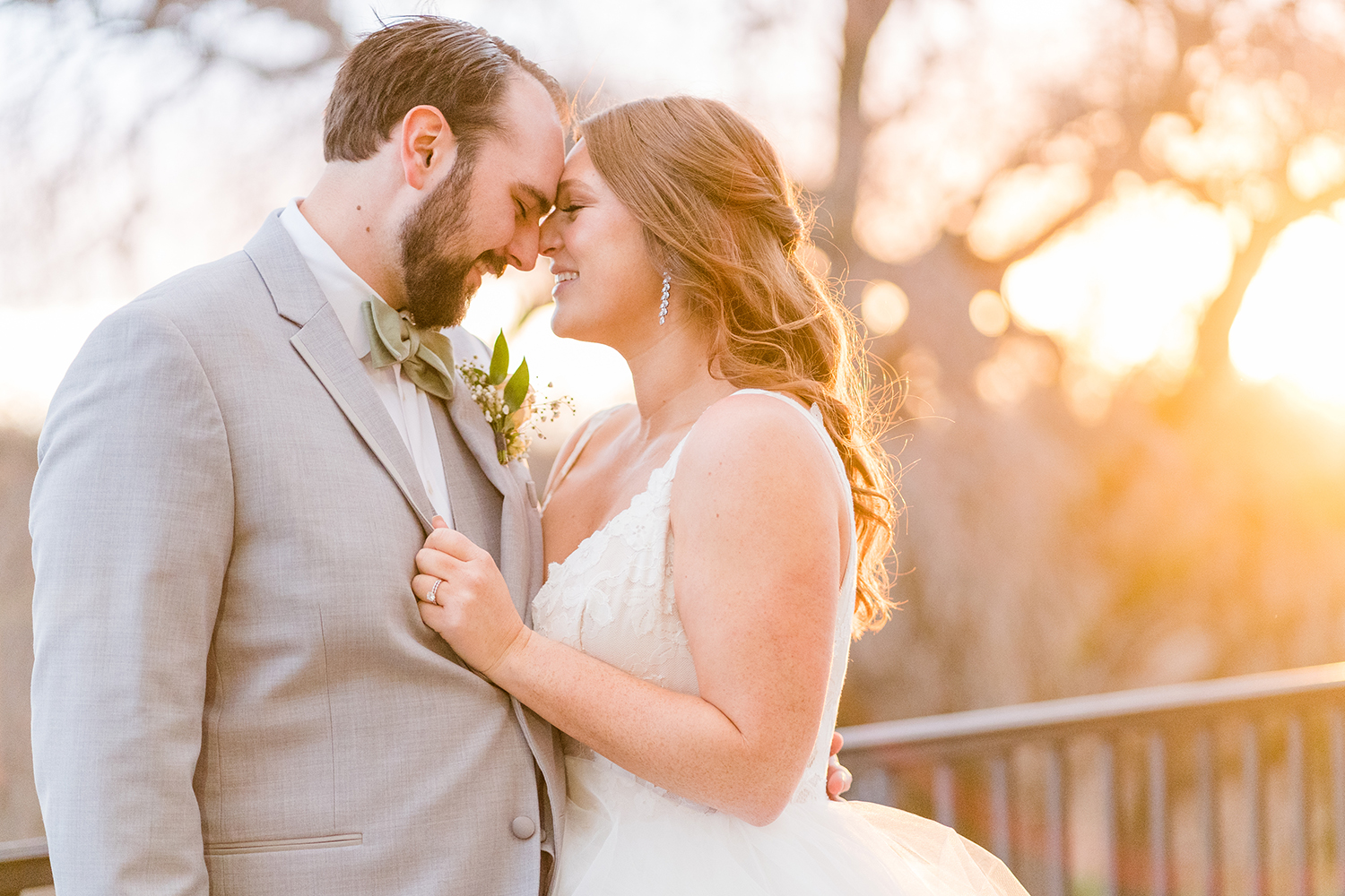 a bride and groom pose for sunset portraits at the Ridge Event Center by Adrienne and Dani Photography