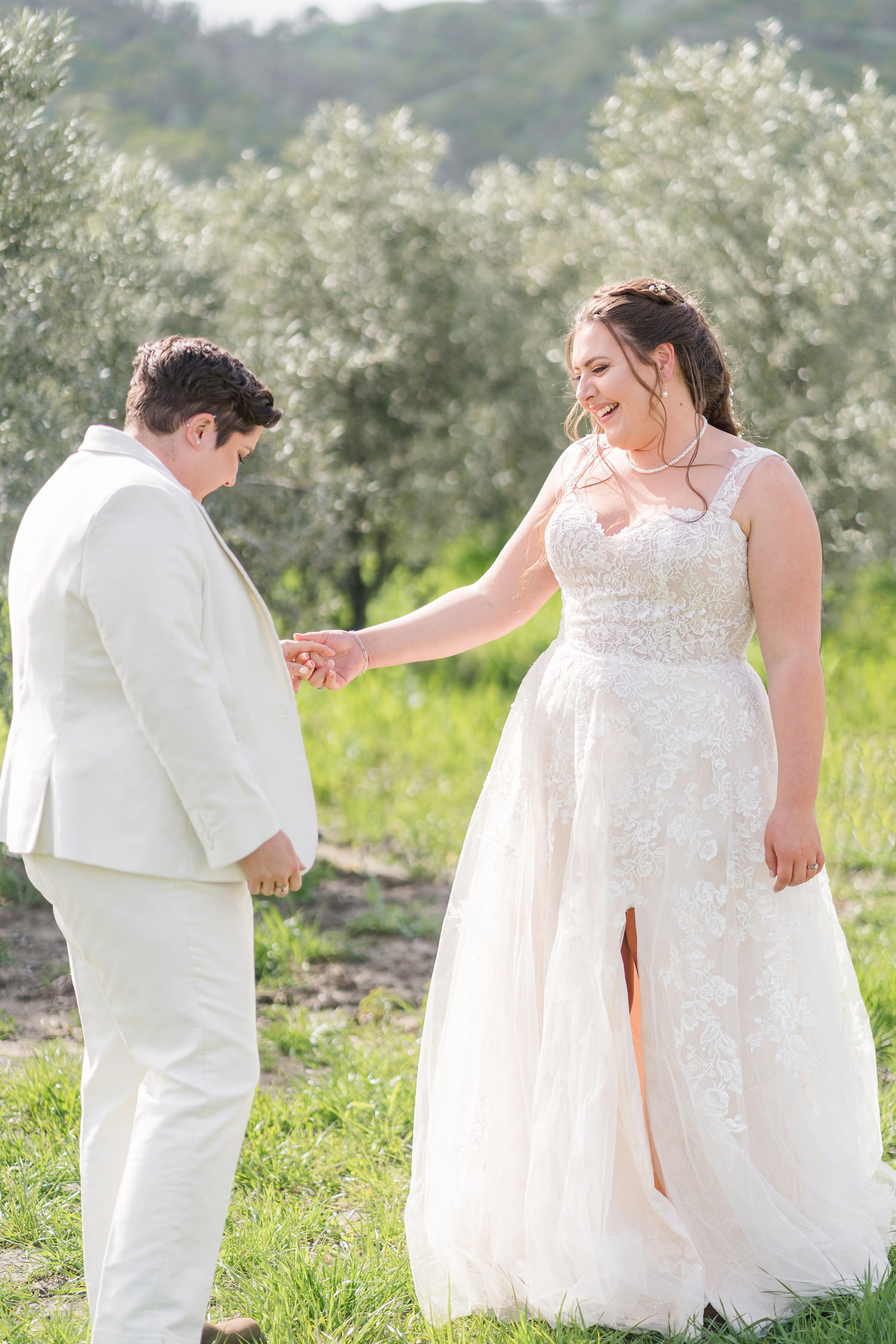 a first look at an lgbtq private estate capay wedding by Adrienne and Dani Photography