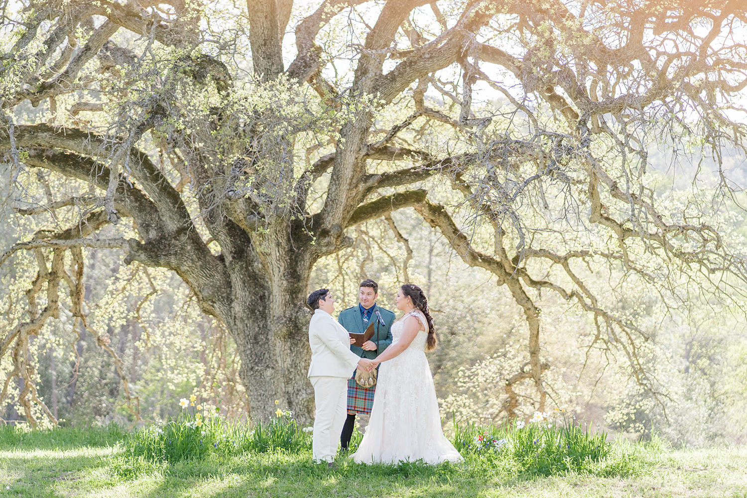 a wedding ceremony at an lgbtq private estate capay wedding by Adrienne and Dani Photography