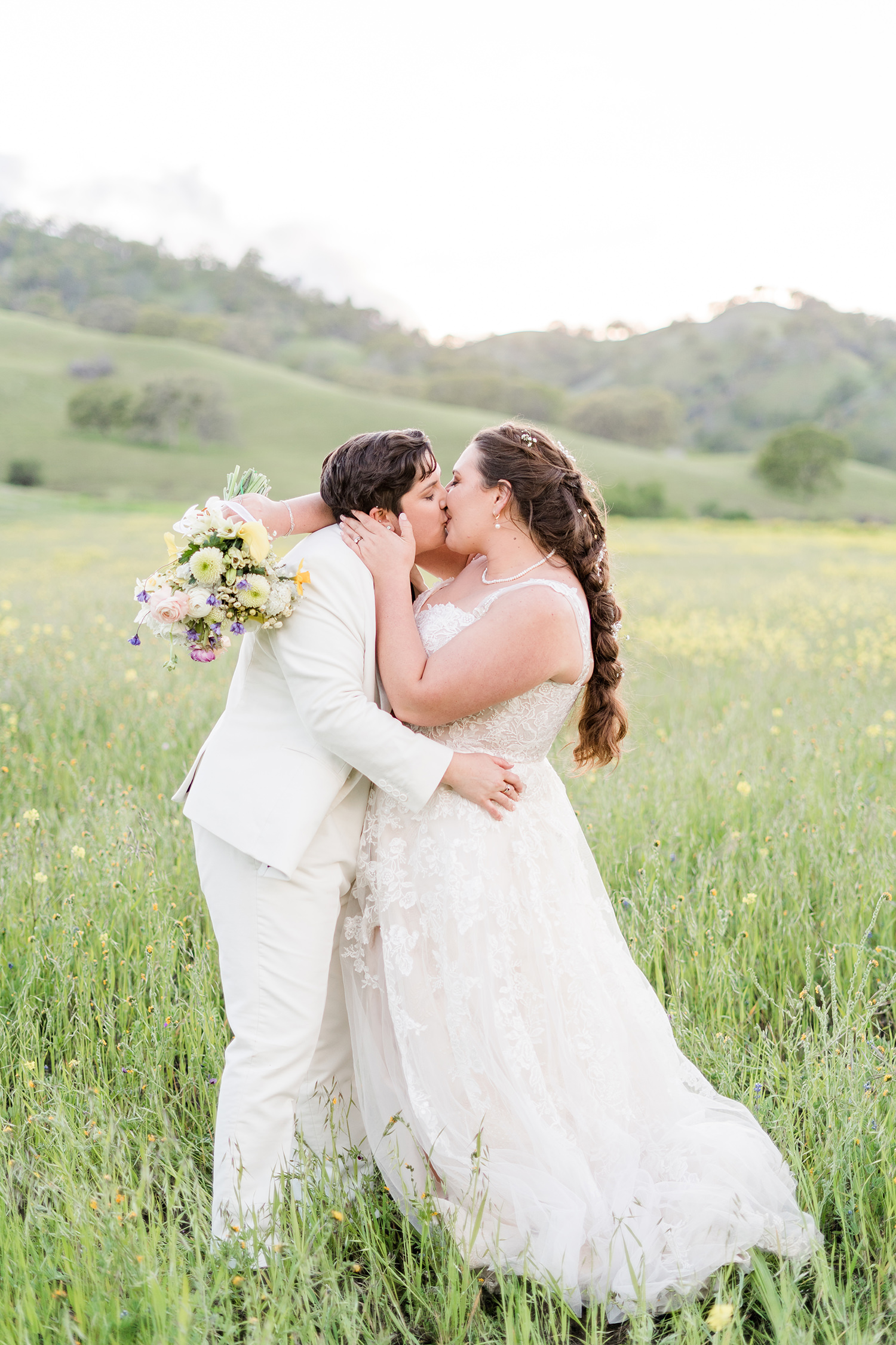 a duo of brides celebrates their wedding at an lgbtq private estate capay wedding by Adrienne and Dani Photography
