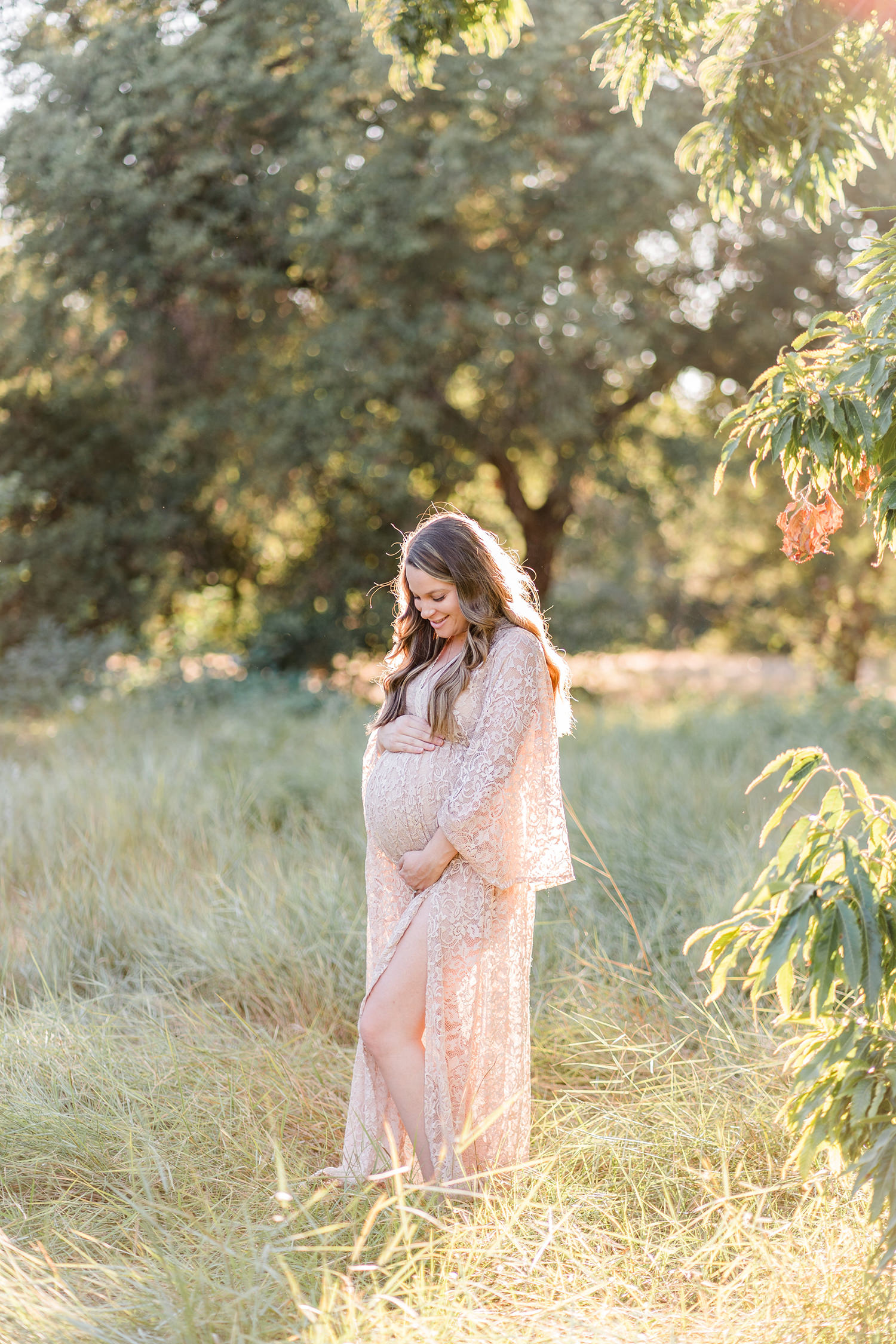 soon to be mother poses for her UC Davis Arboretum Maternity Portraits by adrienne and dani photography