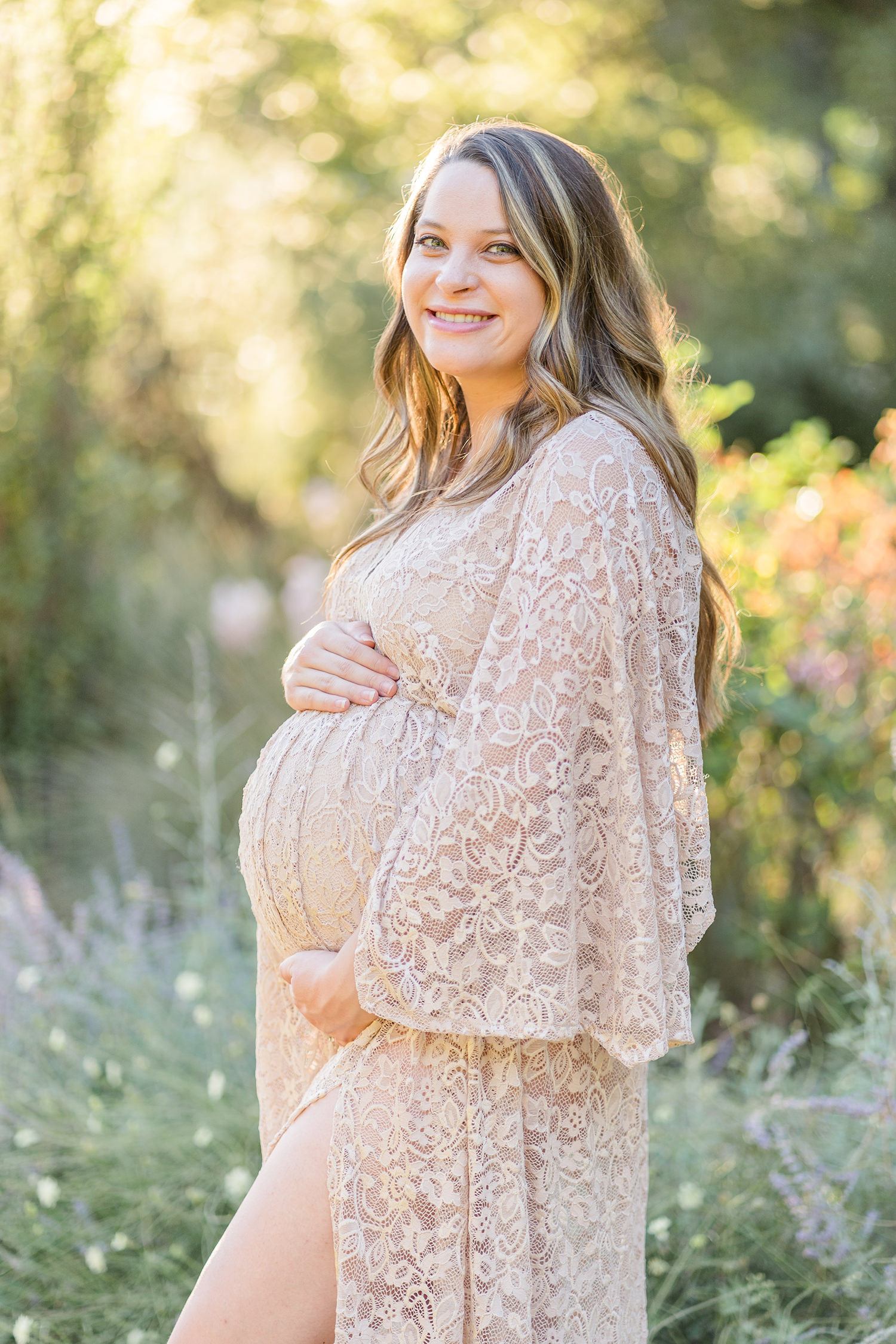 soon to be mother poses for her UC Davis Arboretum Maternity Portraits by adrienne and dani photography