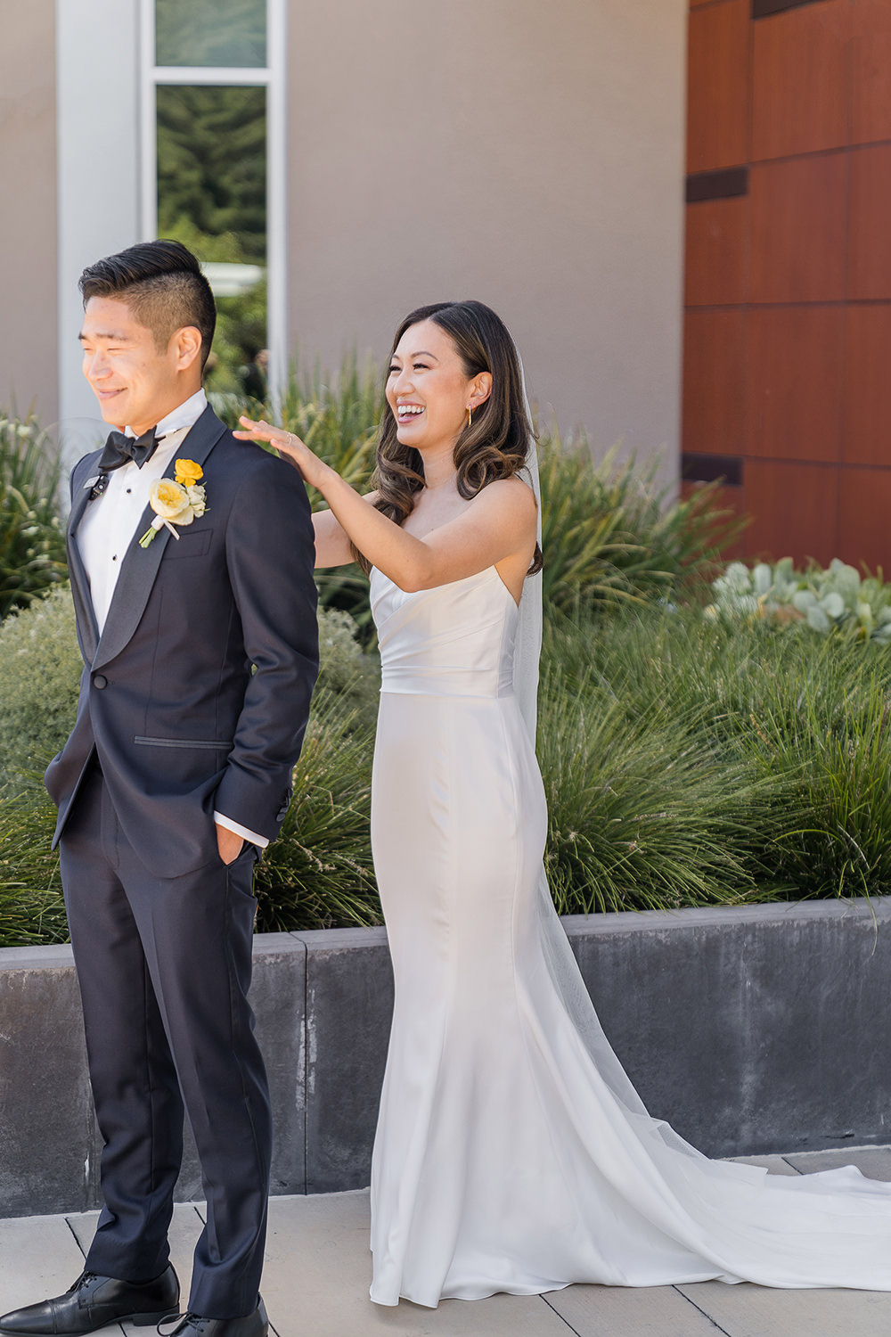 a bride surprises her groom during their first look at their Piedmont Park Wedding