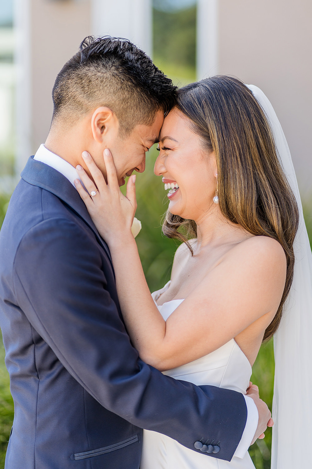 a bride and groom laugh together at their Piedmont Park Wedding