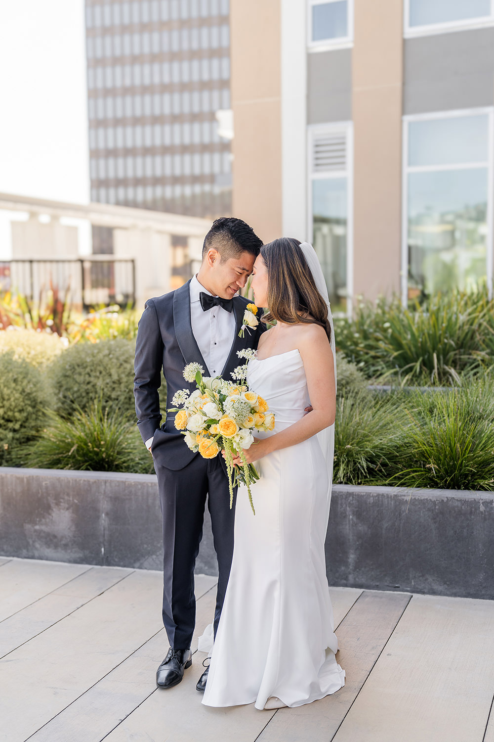 a bride and groom share an intimate moment with their foreheads together at their Piedmont Park Wedding