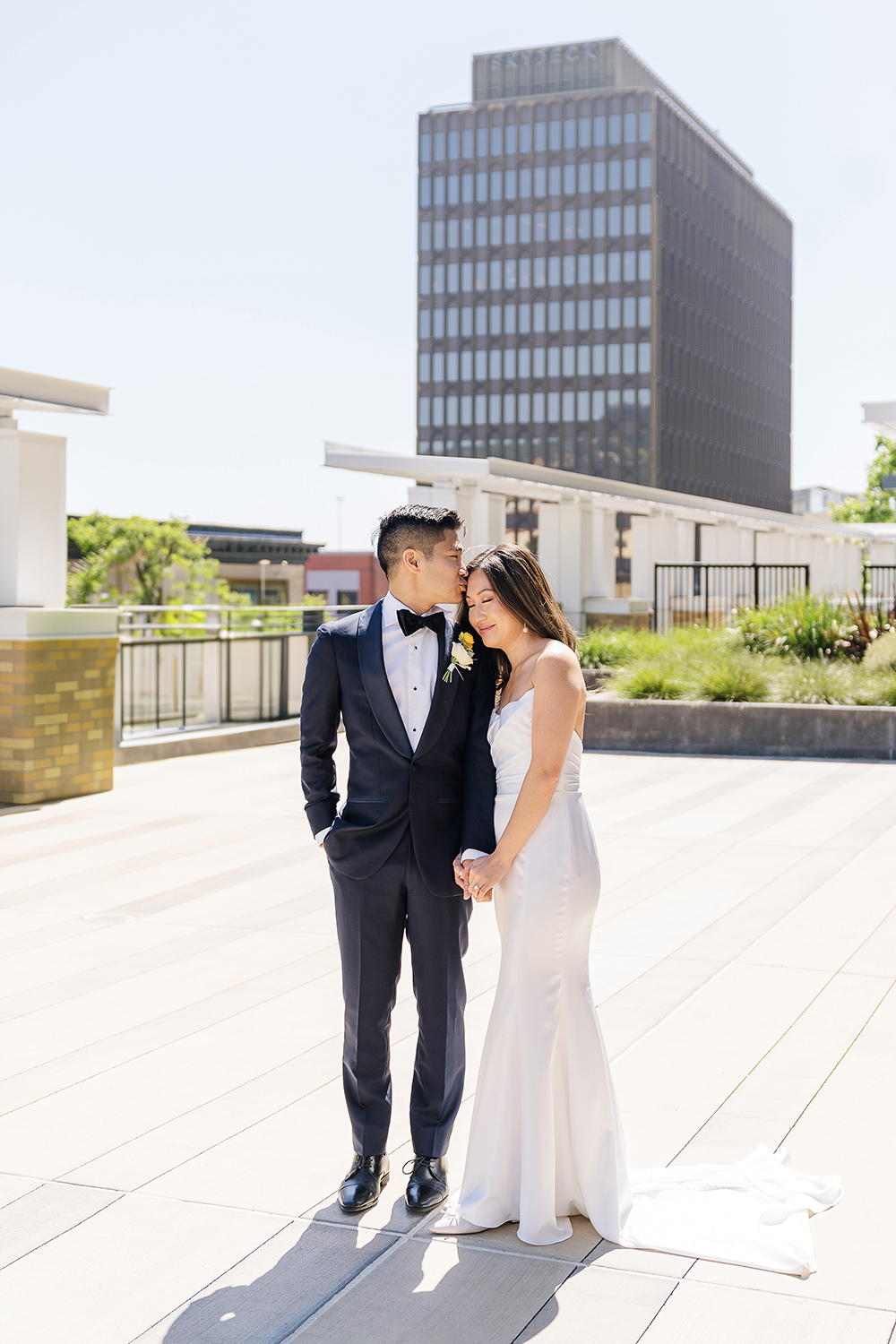 a bride and groom share an intimate moment with their foreheads together at their Piedmont Park Wedding