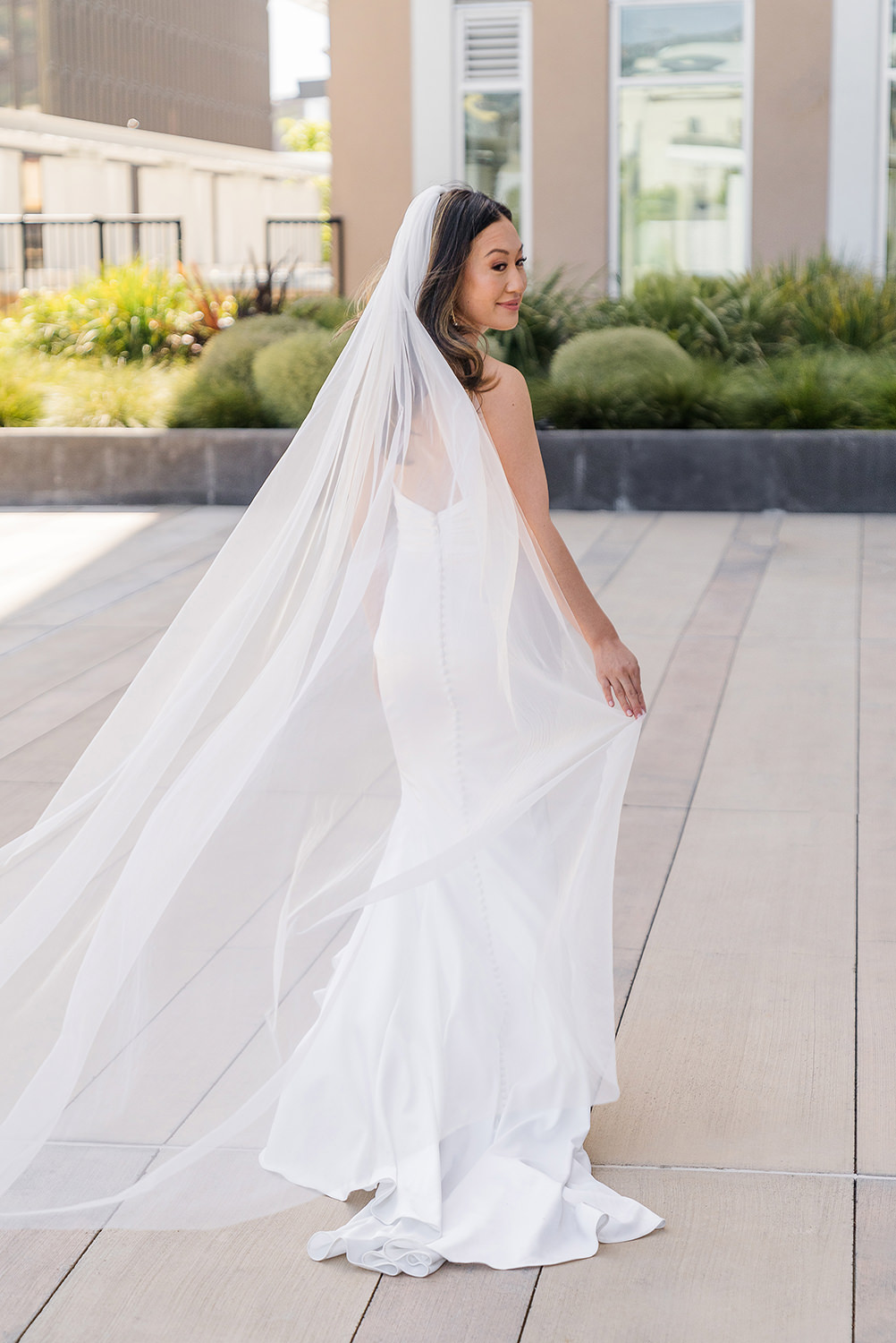 a bride poses for a portrait at her Piedmont Park Wedding