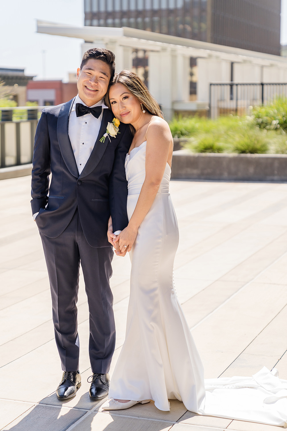 a bride and groom share an intimate moment with their foreheads together at their Piedmont Park Wedding