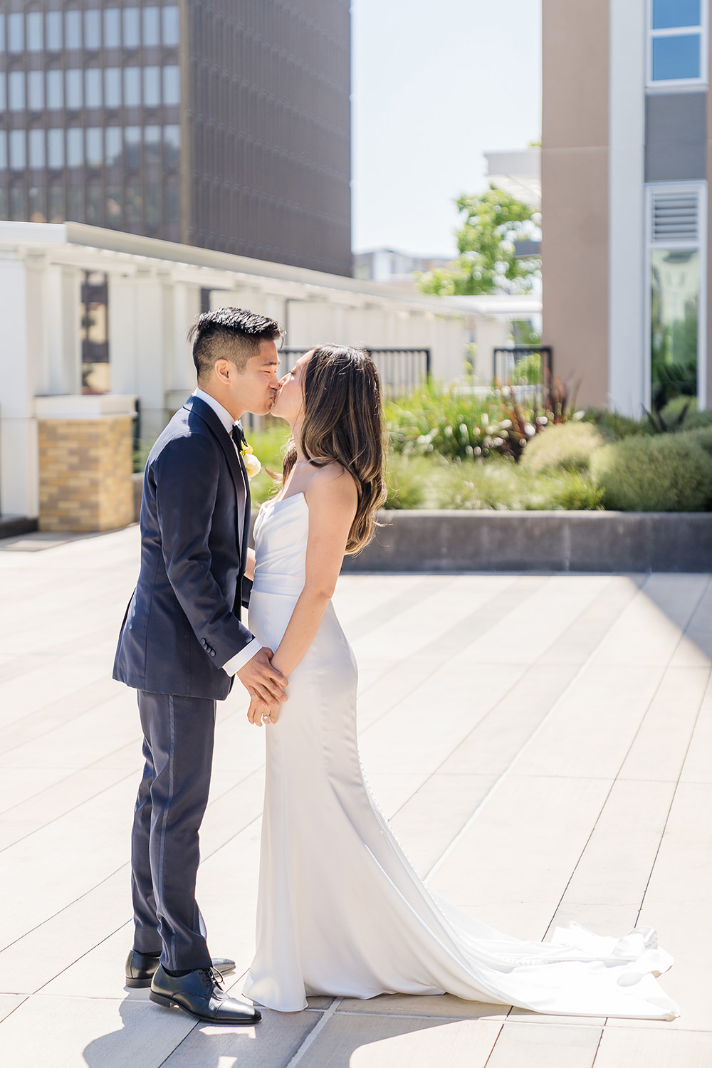 a bride and groom share a kiss at their Piedmont Park Wedding