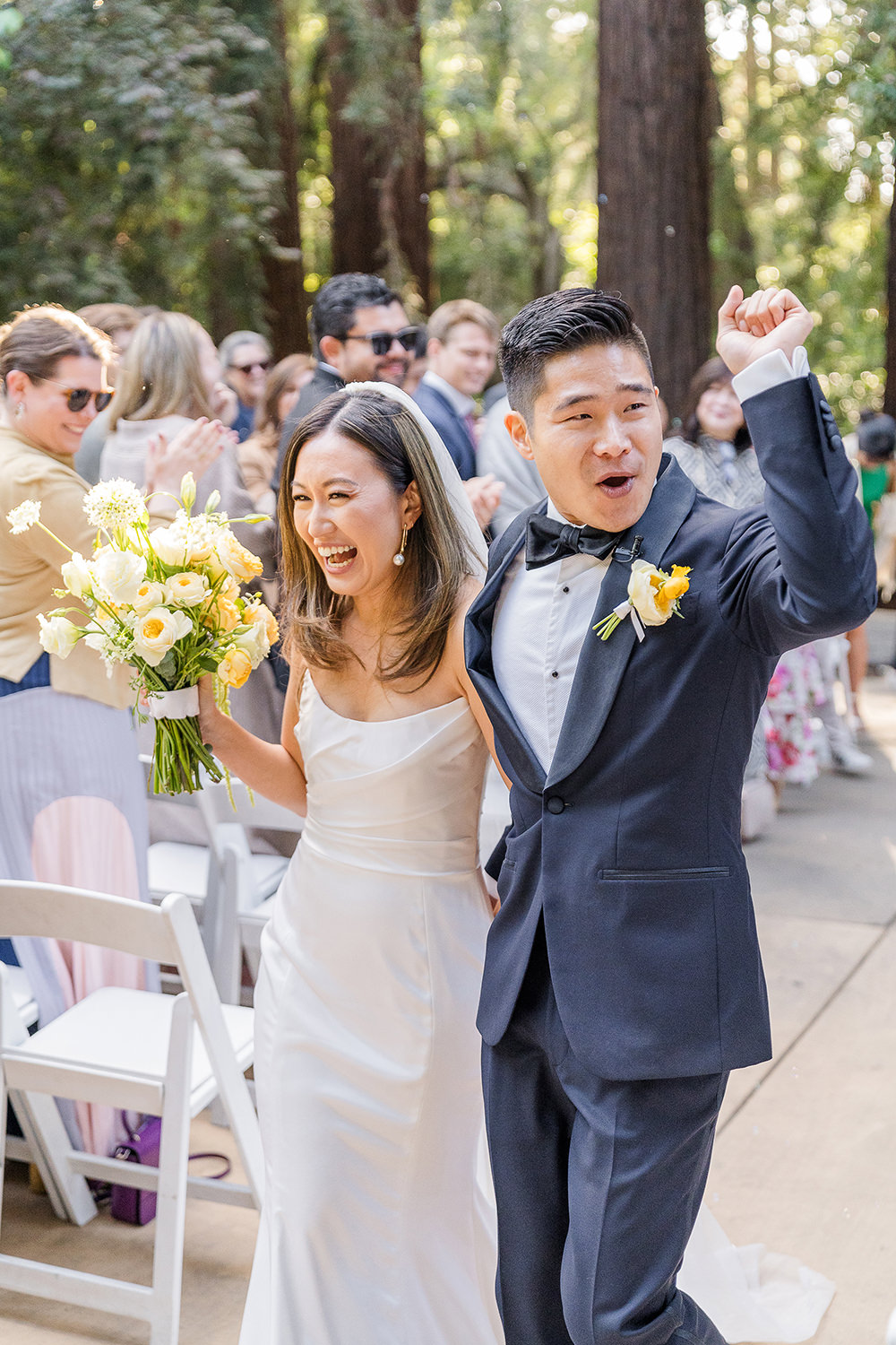 a bride and groom celebrate after their ceremony at their Piedmont Park Wedding