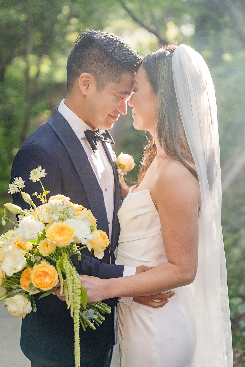 a bride and groom rest their foreheads together at their Piedmont Park Wedding