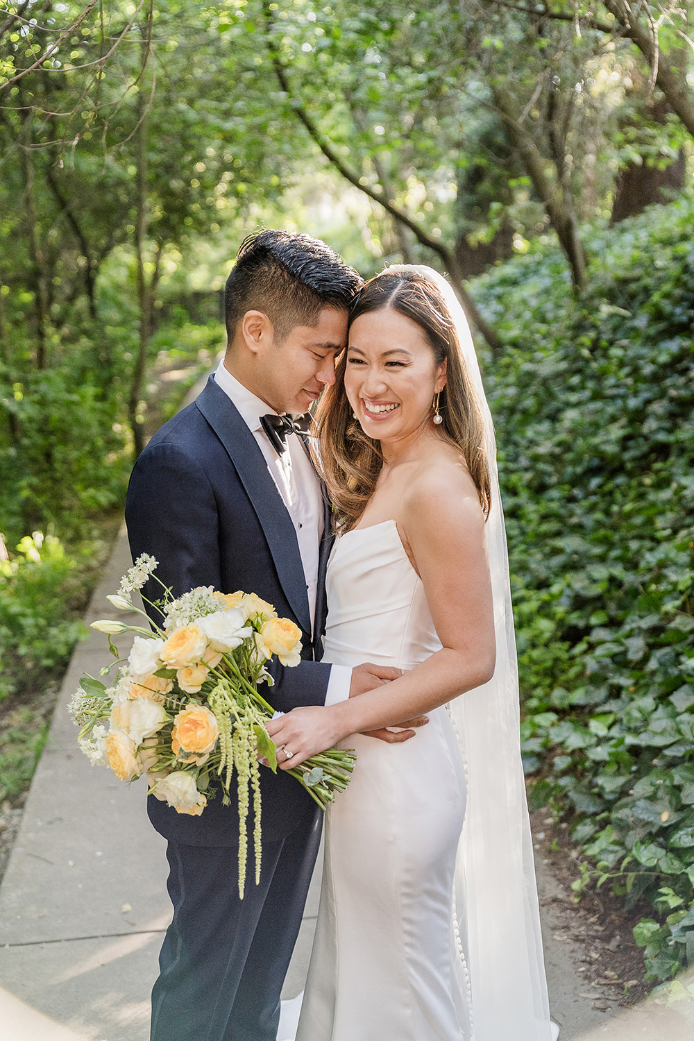 a bride laughs at her groom at their Piedmont Park Wedding