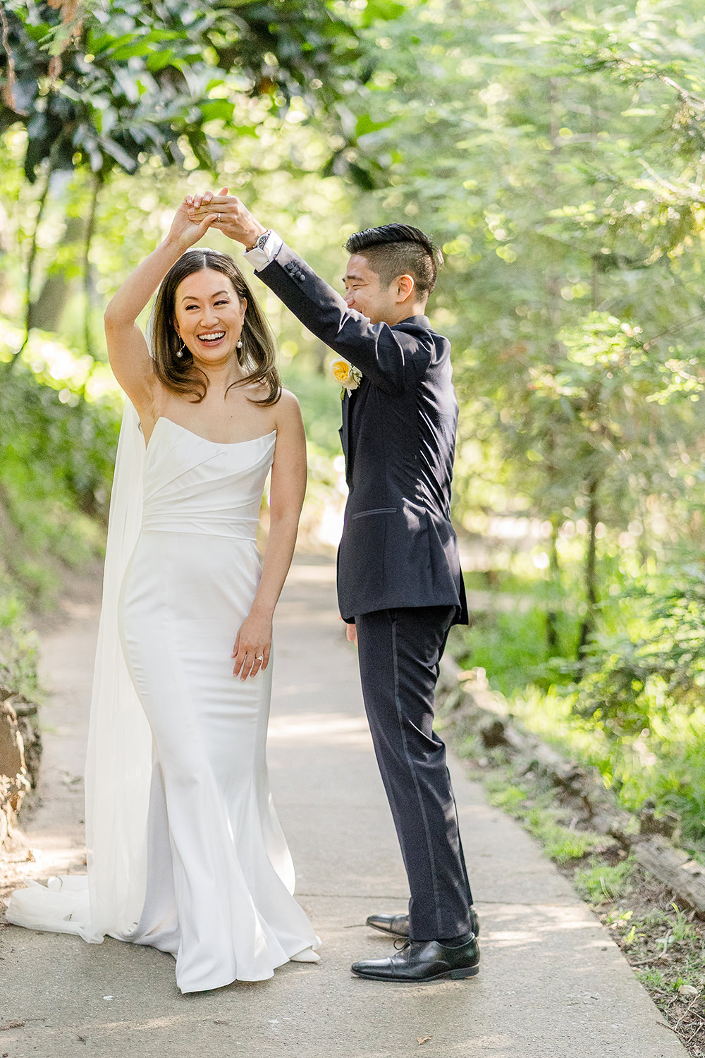 a groom spins his bride at their Piedmont Park Wedding