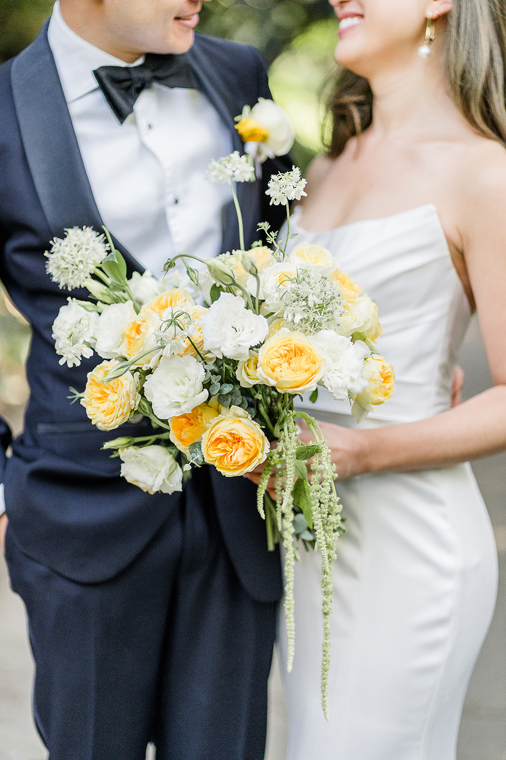 a bridal bouquet of white and yellow roses for a Piedmont Park Wedding