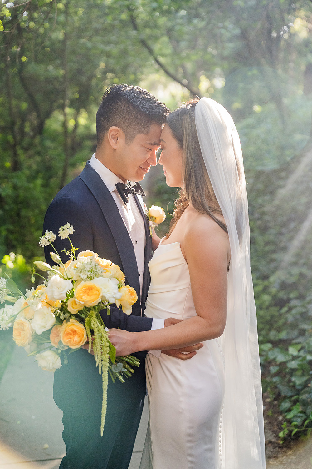 a bride and groom rest their foreheads together at their Piedmont Park Wedding