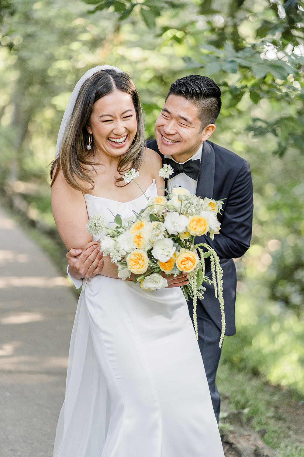 a Piedmont Park Wedding groom makes his bride laugh