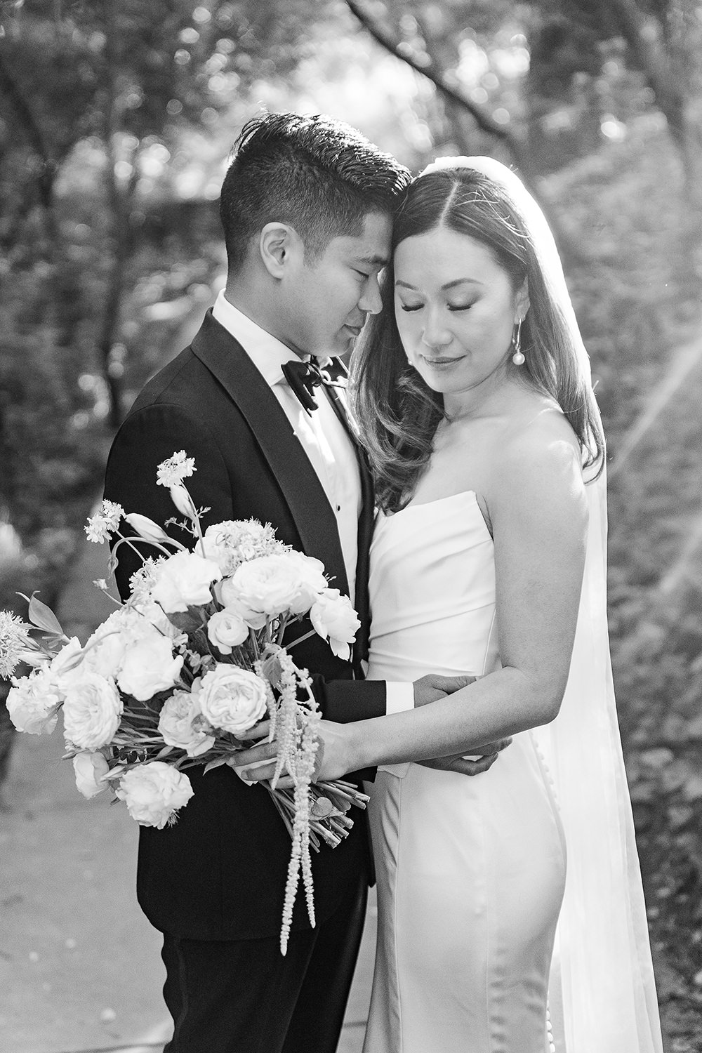 a bride and groom rest their foreheads together at their Piedmont Park Wedding