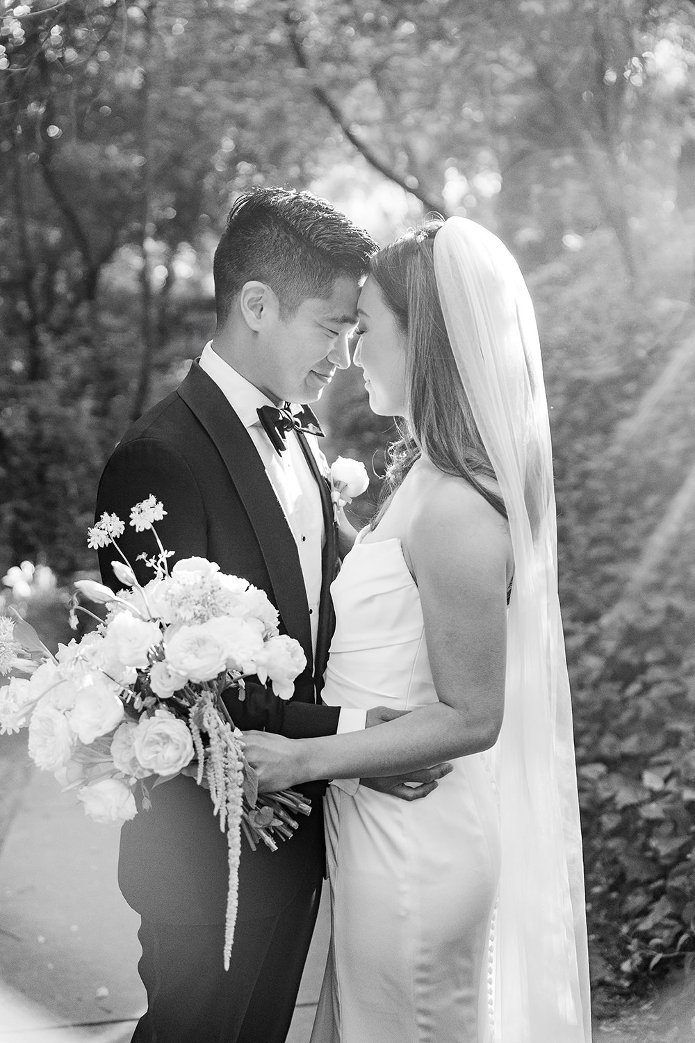 a bride and groom rest their foreheads together at their Piedmont Park Wedding