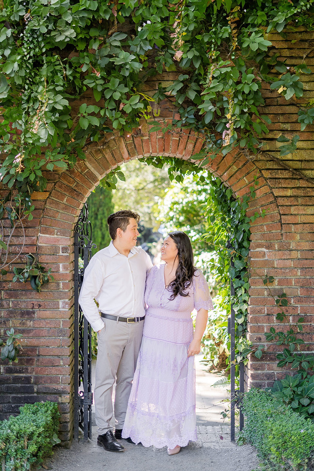 a bride and groom to be share an moment together during their filoli gardens engagement photos.