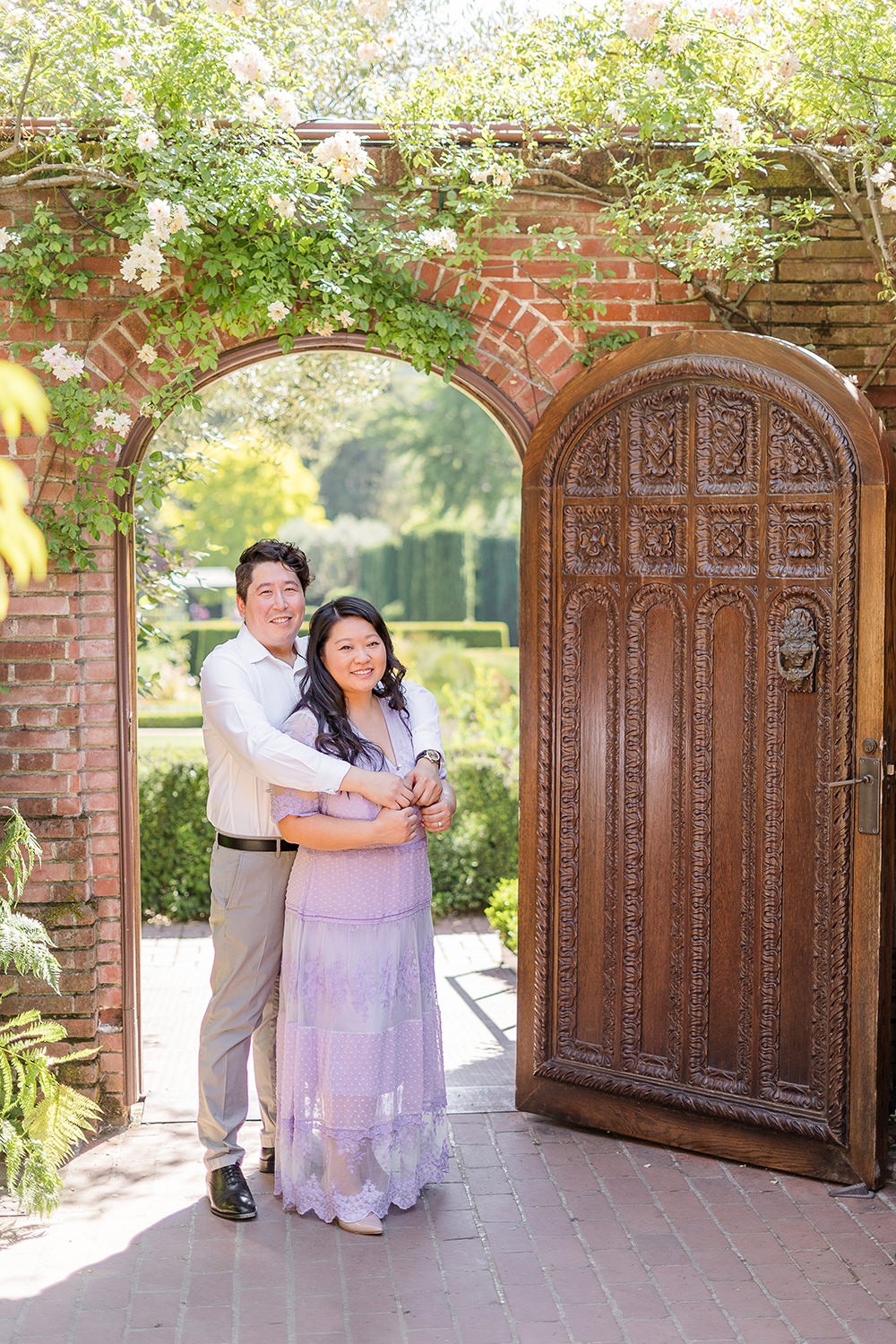 a bride and groom to be share an moment together during their filoli gardens engagement photos.