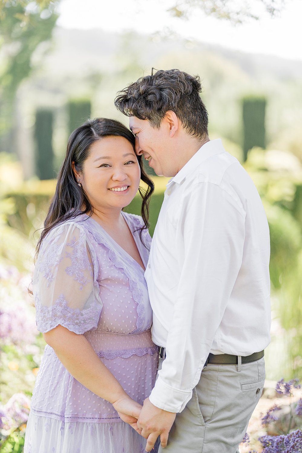 a bride and groom to be share an moment together during their filoli gardens engagement photos.