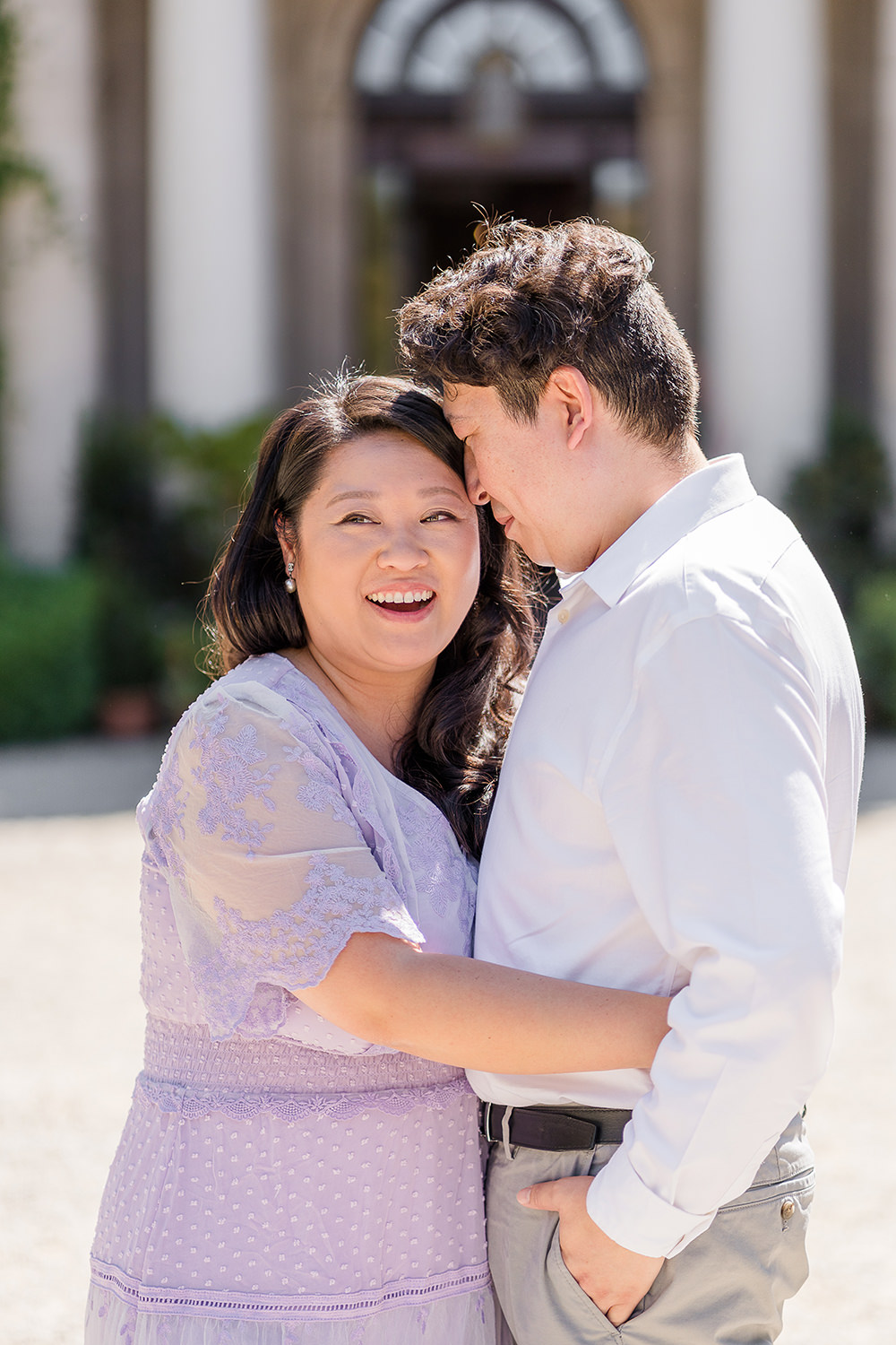 a bride and groom to be share an laugh together during their filoli gardens engagement photos.