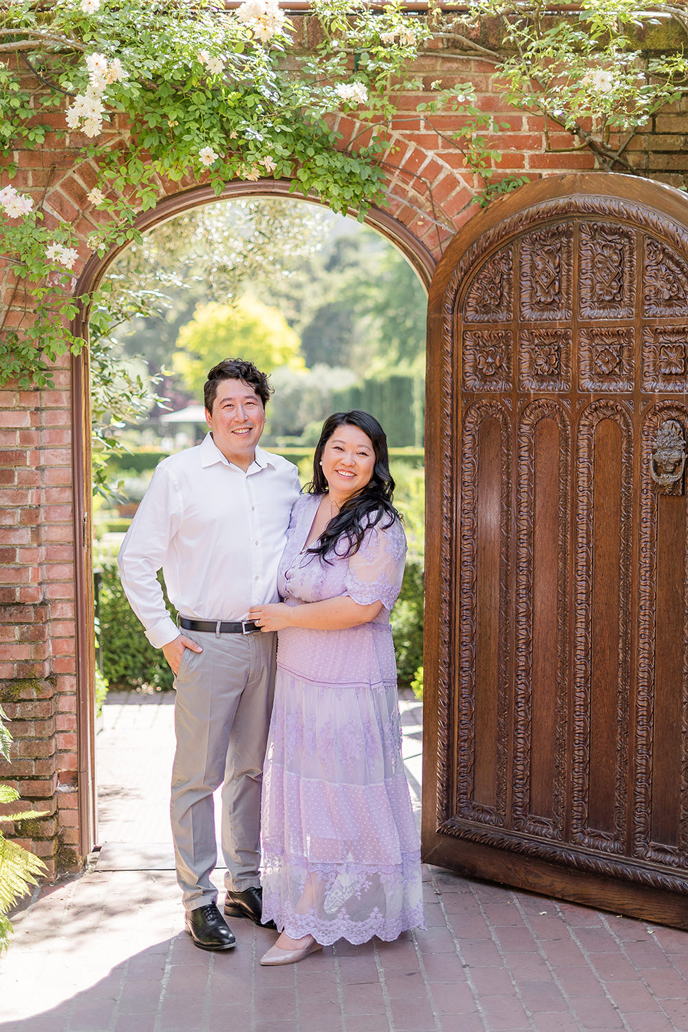 a bride and groom to be share an moment together during their filoli gardens engagement photos.