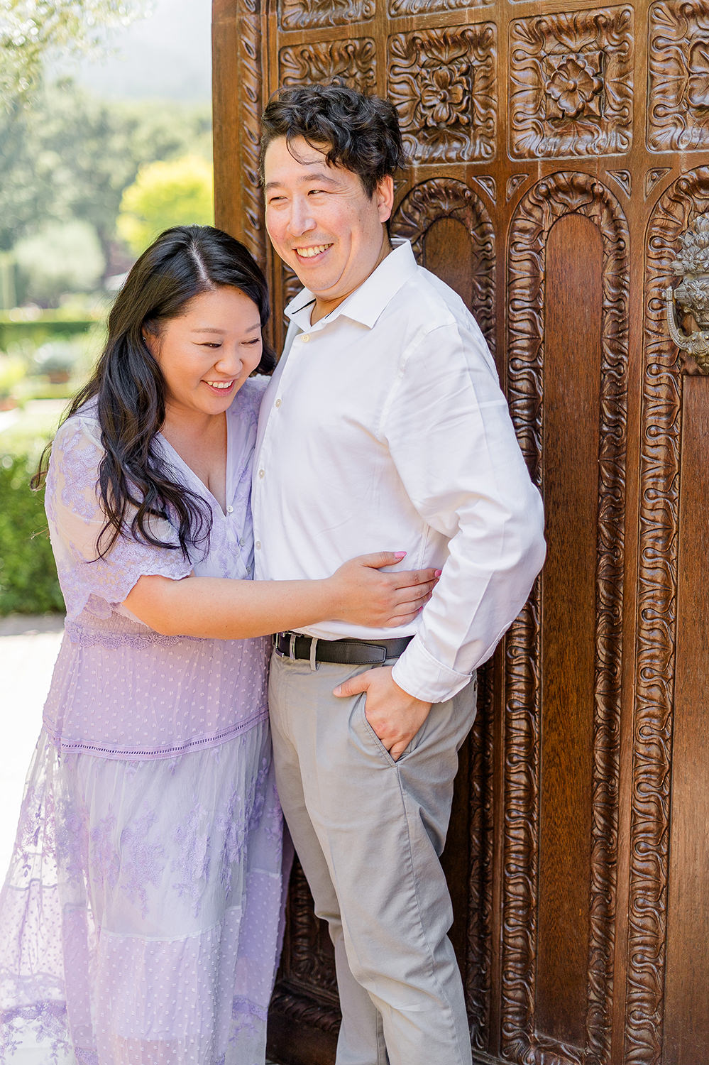 a bride and groom to be share a laugh together during their filoli gardens engagement photos.