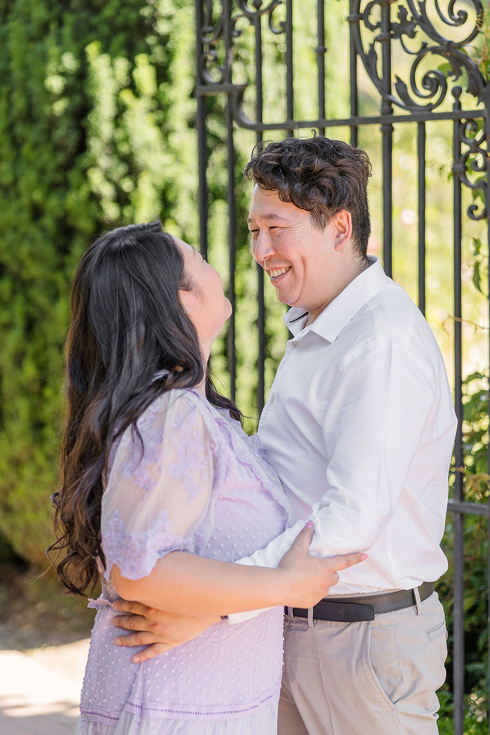 a bride and groom to be share an moment together during their filoli gardens engagement photos.