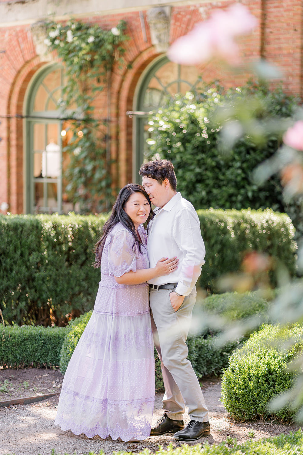 a bride and groom to be share an moment together during their filoli gardens engagement photos.