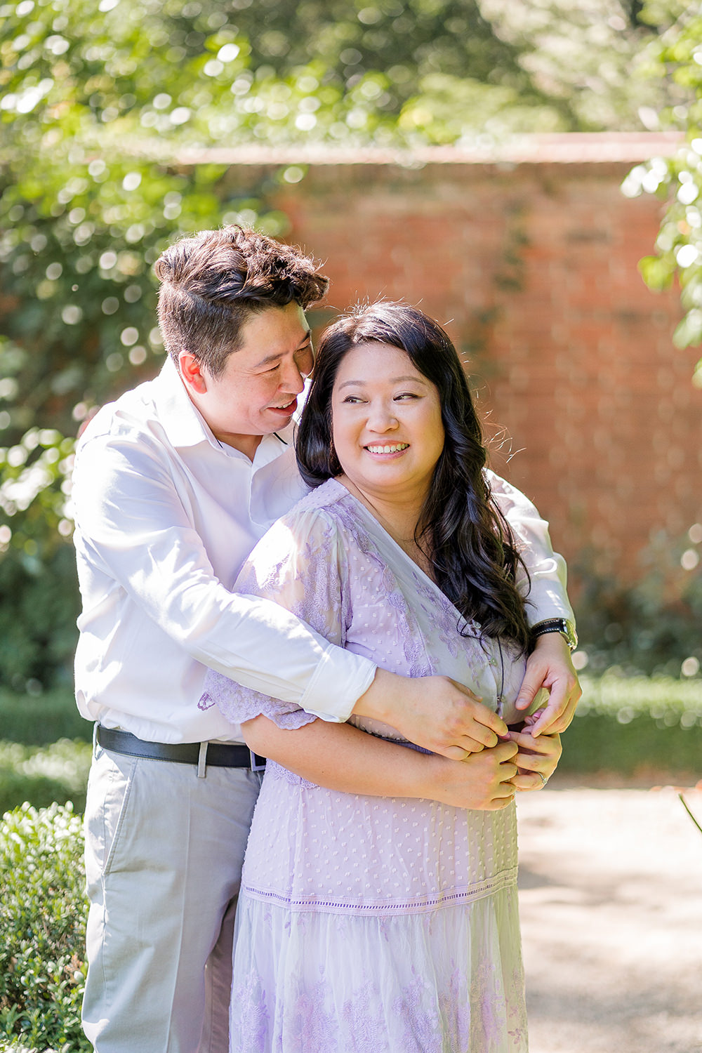 a bride and groom to be share an moment together during their filoli gardens engagement photos.