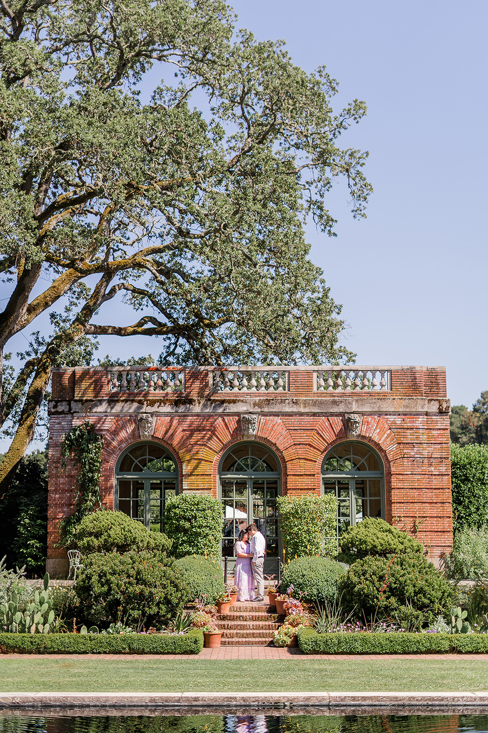 a bride and groom to be share an moment together during their filoli gardens engagement photos.