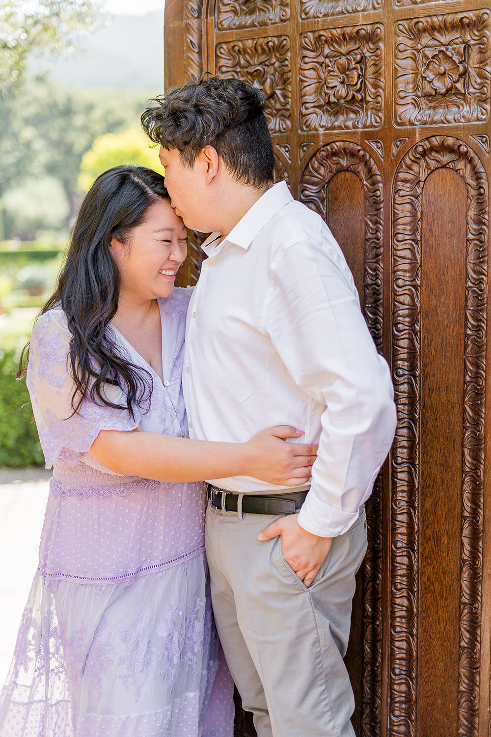 a bride and groom to be share an moment together during their filoli gardens engagement photos.