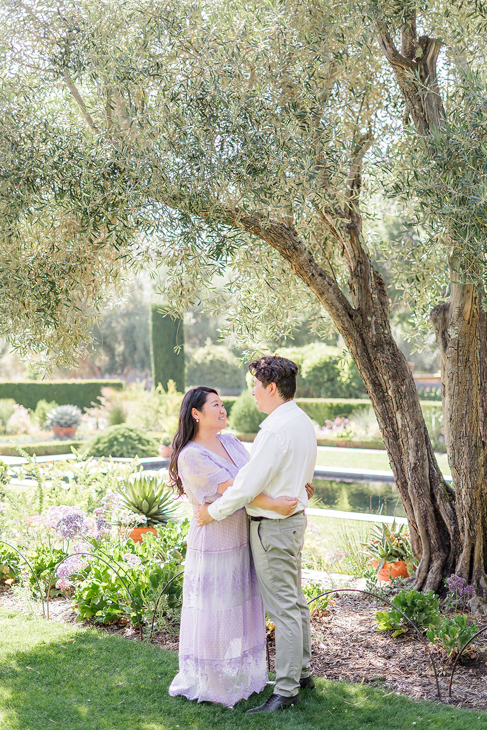 a bride and groom to be share an moment together during their filoli gardens engagement photos.