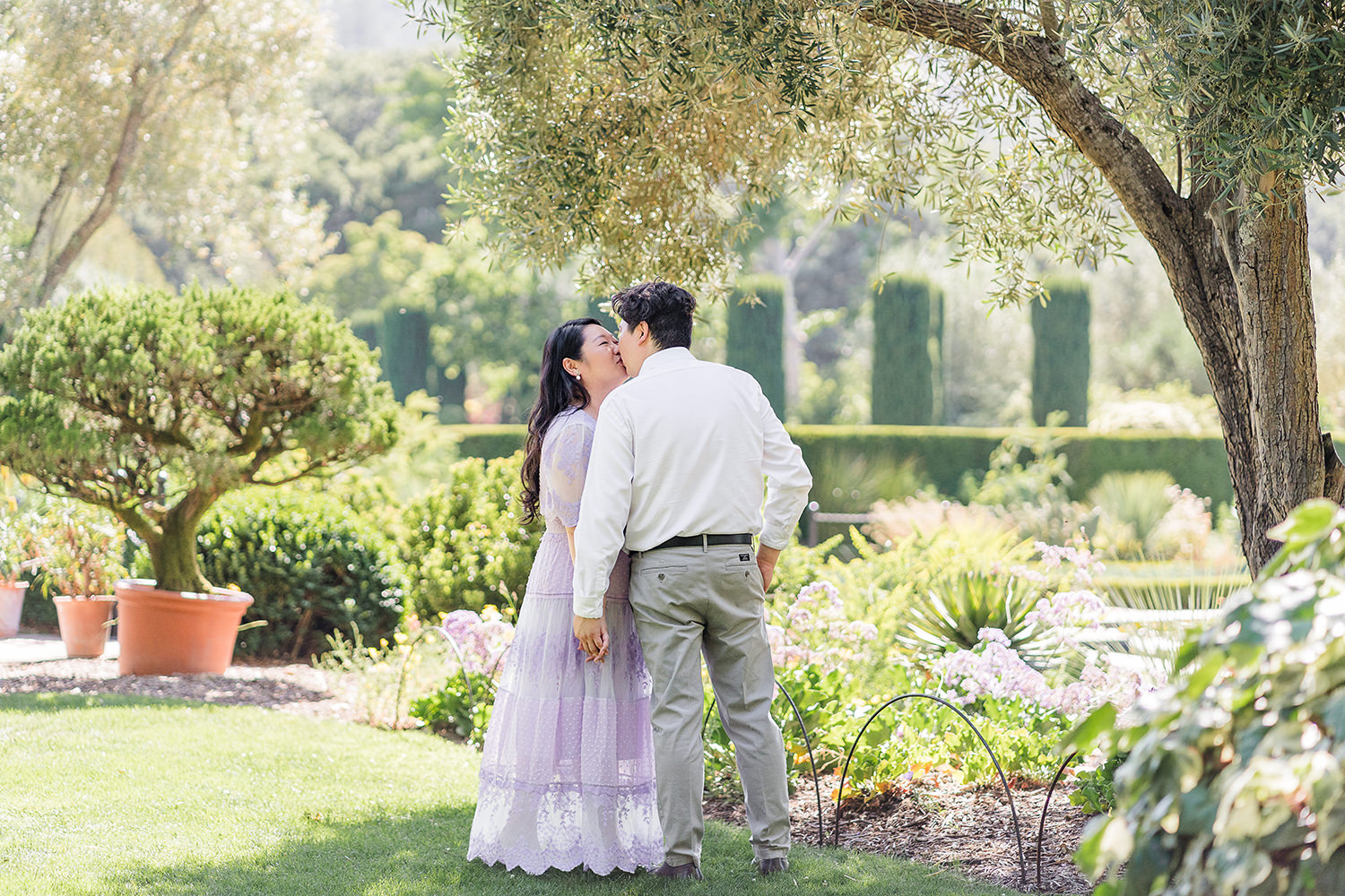 a bride and groom to be share an moment together during their filoli gardens engagement photos.