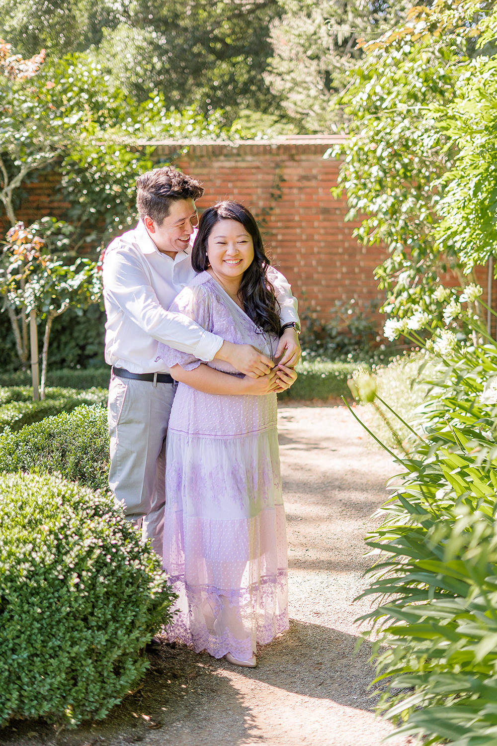 a bride and groom to be share an moment together during their filoli gardens engagement photos.