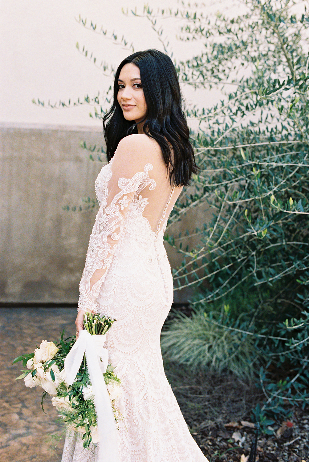 a bride posing for her vizcaya sacramento Wedding Venue bridal portraits with her bridal bouquet photographed on Kodak Portra 400 Film 