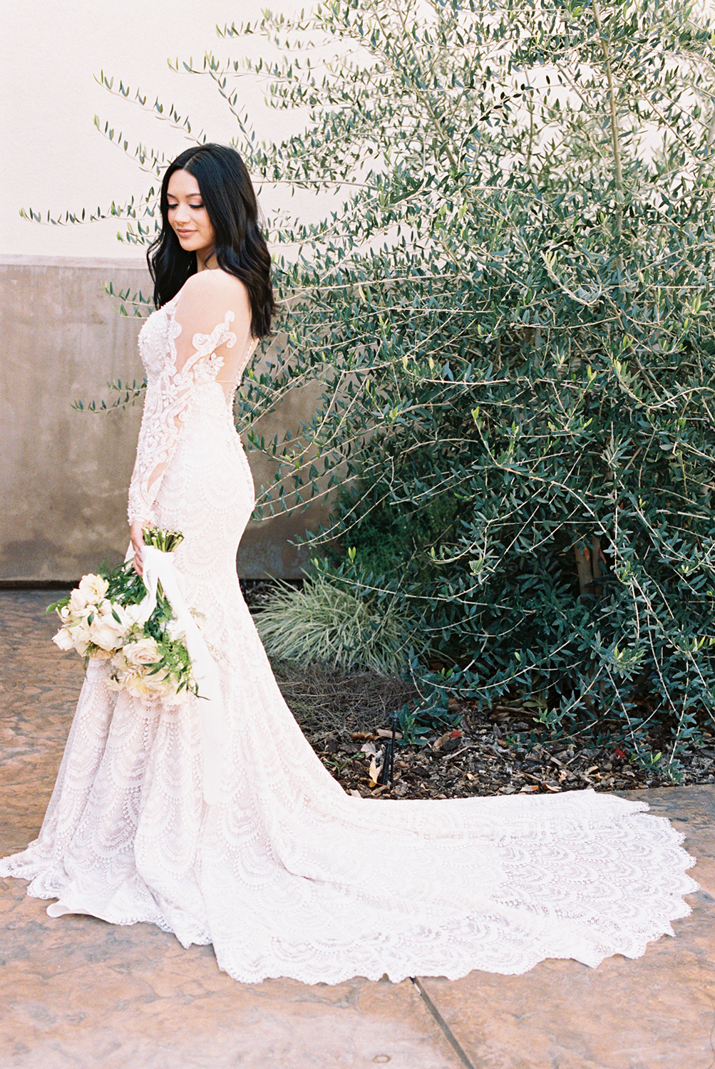 a bride posing for her vizcaya sacramento Wedding Venue bridal portraits with her bridal bouquet photographed on Kodak Portra 400 Film 