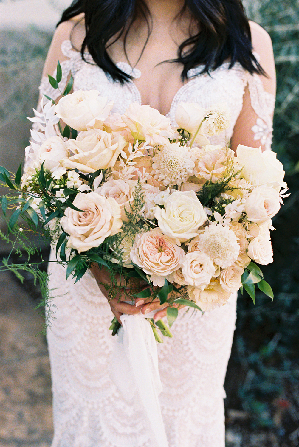 a bride posing for her vizcaya sacramento Wedding Venue bridal portraits with her bridal bouquet photographed on Kodak Portra 400 Film 